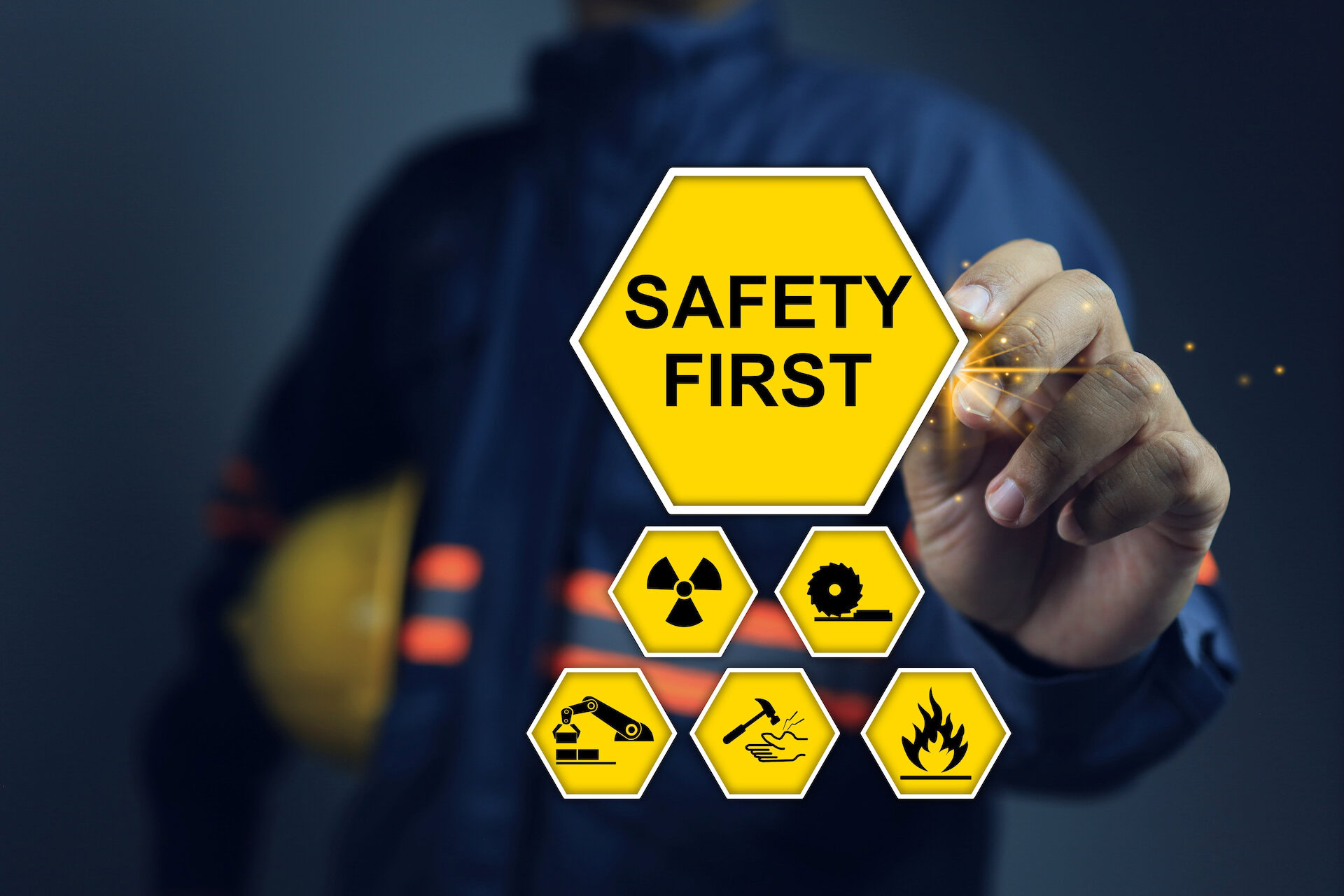 A graphic of a tradesman pointing at a safety first sign